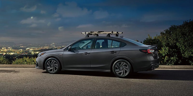 Subaru sedan is parked with left side view.