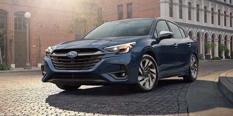 blue SUV parked on a city street