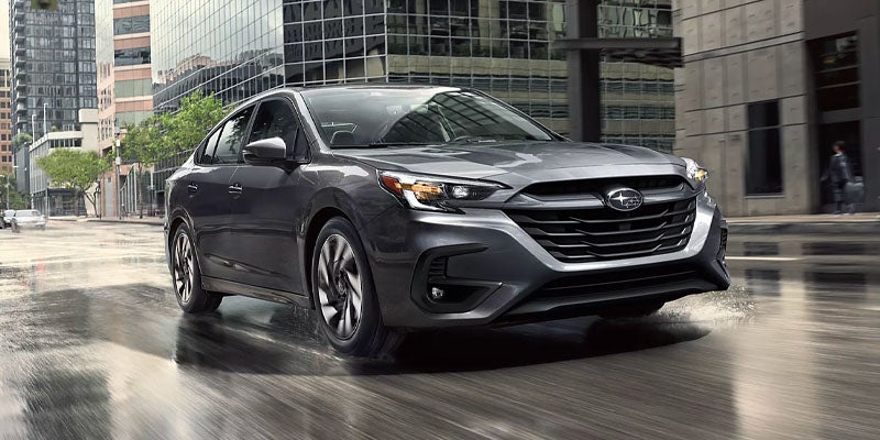 Black SUV driving on a road