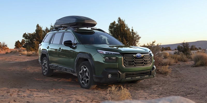 2026 Subaru SUV with rooftop cargo box.